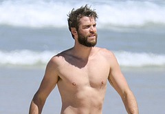 Liam Hemsworth nude on a beach