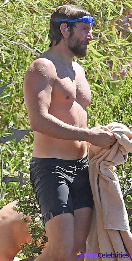 Bradley Cooper shirtless beach photos.