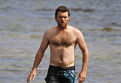 Sam Worthington shirtless on beach