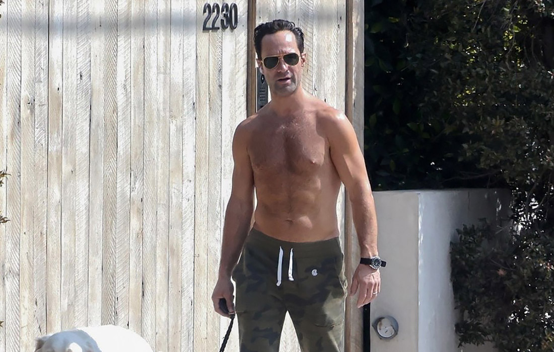 Chris Diamantopoulos showed off his hairy chest while walking his dog
