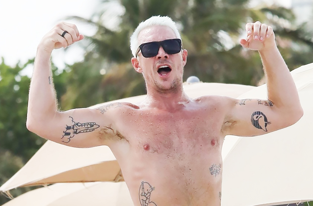 Diplo teases the audience with her naked torso on the beach