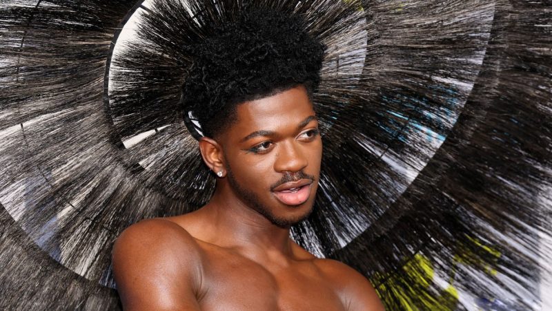 Lil Nas X flaunts his nude torso in a skirt and headpiece at the MTV Video Music Awards