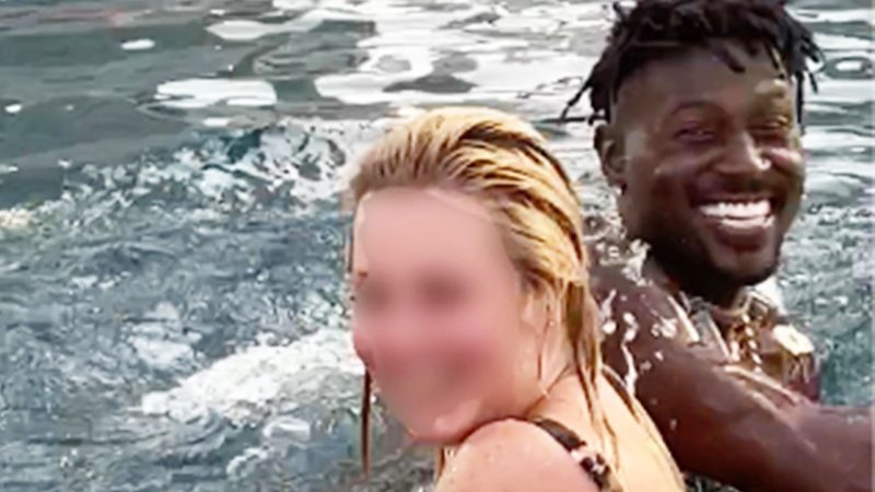 Fully naked Antonio Brown has fun with a woman in the pool