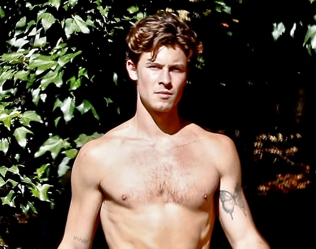 Shawn Mendes exposes his awesome torso while hiking