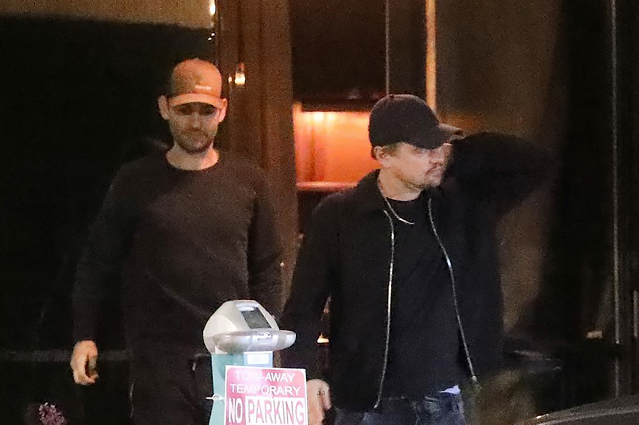 Leonardo DiCaprio having fun with Tobey Maguire at the bar