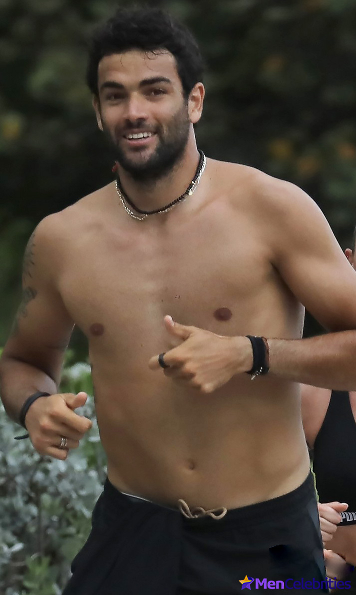 Matteo Berrettini shows off his beefy torso while jogging