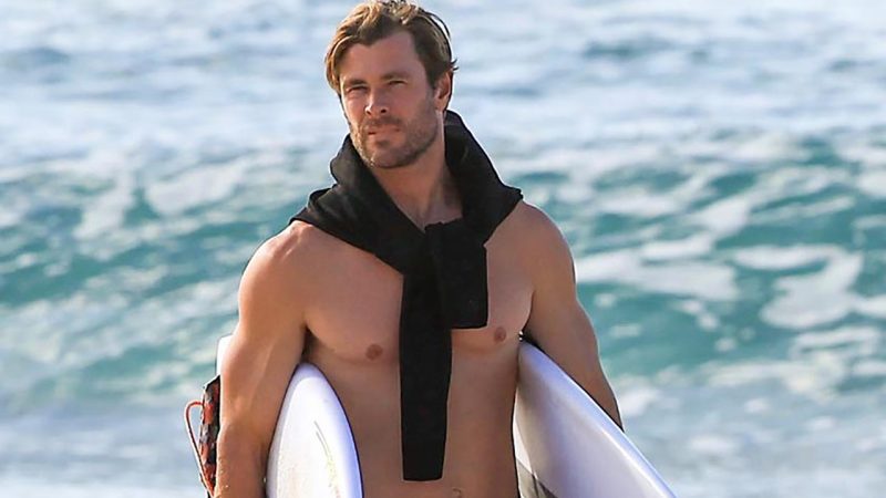 Chris Hemsworth shows off his incredible muscles on the beach