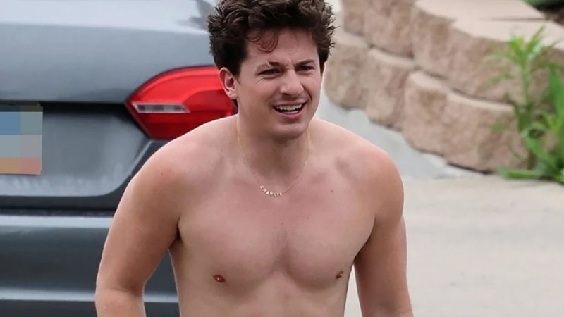 Charlie Puth shows off his naked torso while running