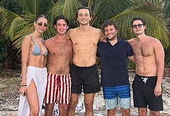 Ben Ahlers on a beach