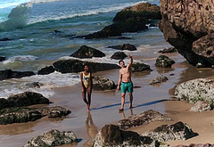 Patrick Gibson on a beach