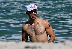 Joe Jonas shirtless on a beach