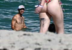 Joe Jonas shirtless on a beach