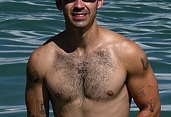 Joe Jonas shirtless on a beach