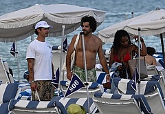 Joe Jonas shirtless on a beach