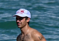 Joe Jonas shirtless on a beach