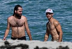 Joe Jonas shirtless on a beach