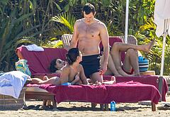 Callum Turner shirtless on beach