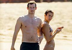 Callum Turner shirtless on beach