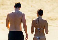 Callum Turner shirtless on beach