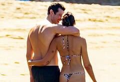 Callum Turner shirtless on beach