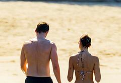 Callum Turner shirtless on beach