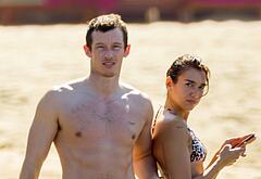 Callum Turner shirtless on beach