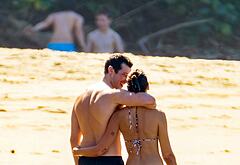 Callum Turner shirtless on beach