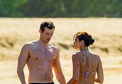 Callum Turner shirtless on beach